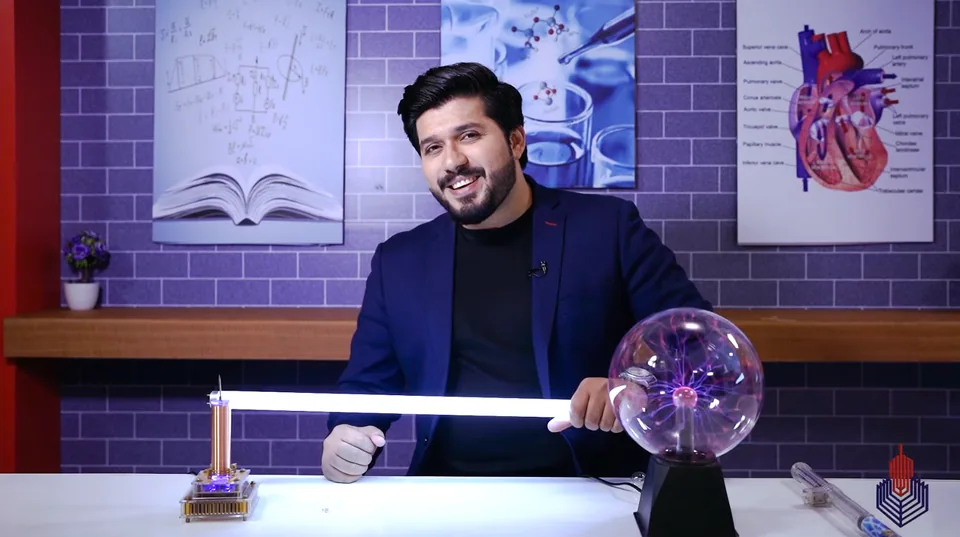 Hassaan demonstrating physics with a plasma globe