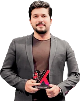 Hassaan Fareed holding a TEDx memento